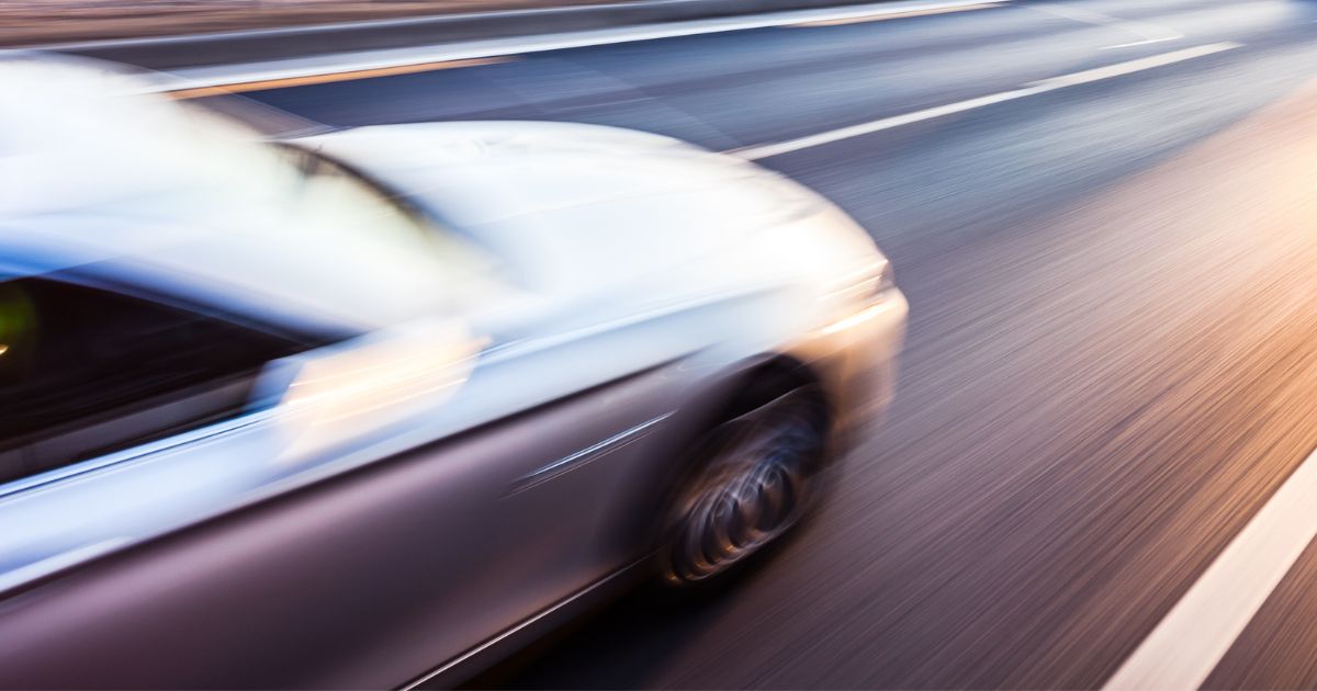 car speeding down the highway during memorial day weekend