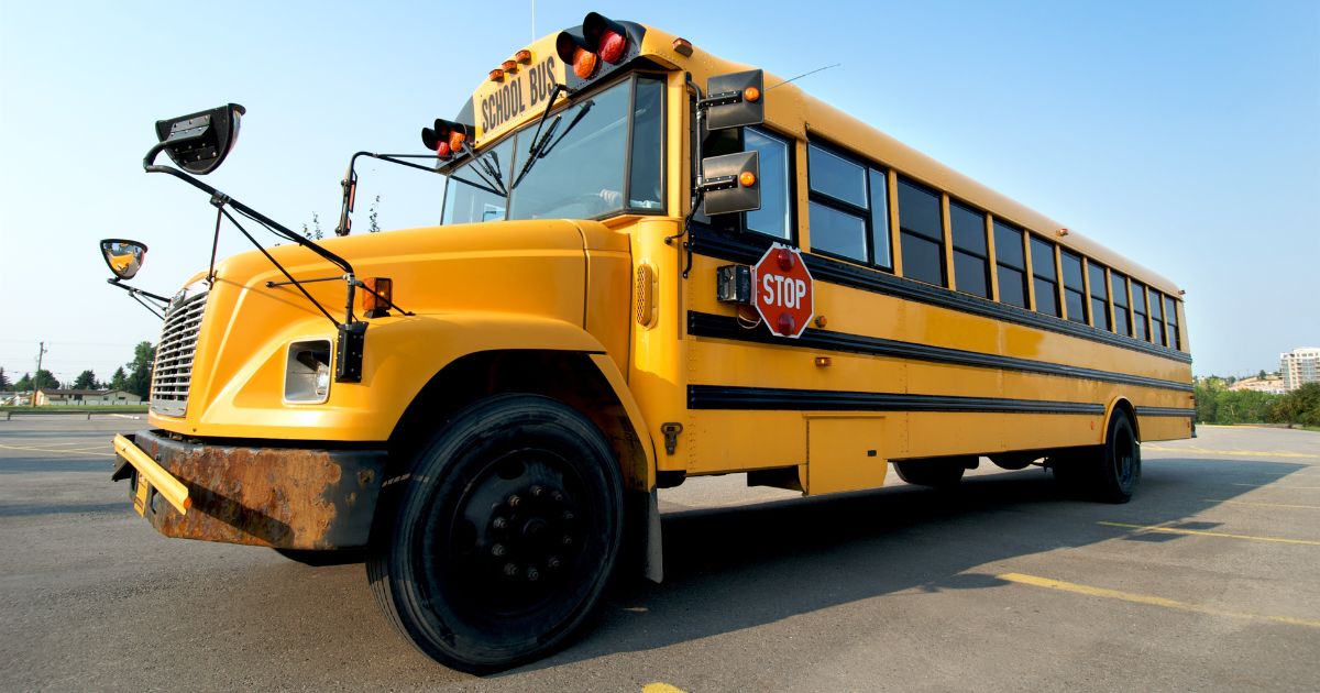 yellow school bus parked in daylight